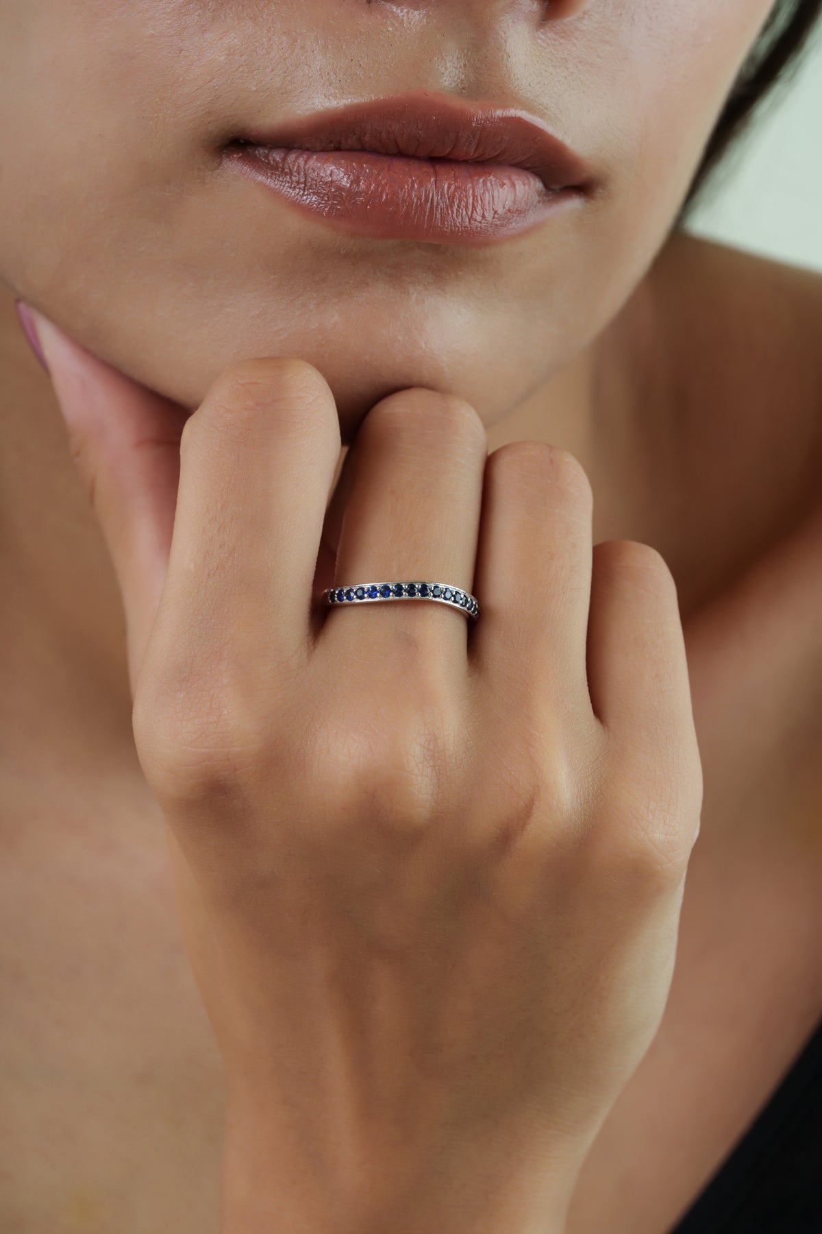 Elegant 14K Gold Blue Sapphire Wishbone Chevron Stacking Ring featuring natural round blue sapphires in a minimalist curved V-shaped band for women.